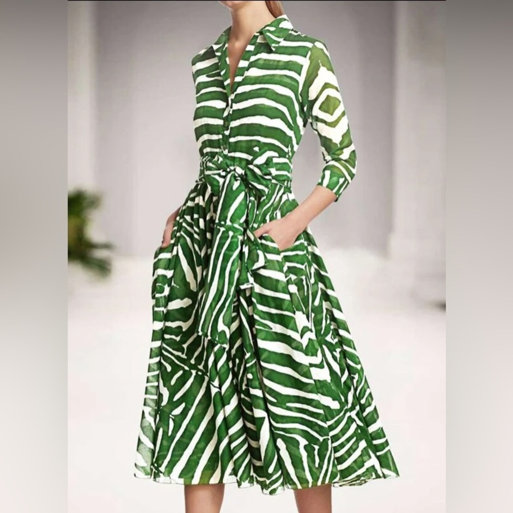 Green and white print shirt dress long sleeve with a tie belt. Fits US size L